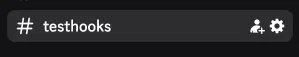 Channel header of #testhooks in Discord: the gear icon for the channel settings is located to the right of the channel name